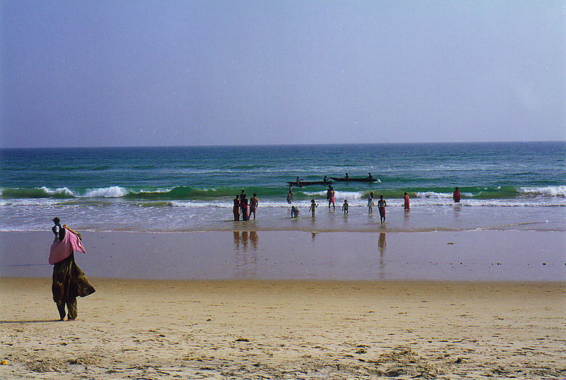 Pilgrims bathing on the beach in Puri