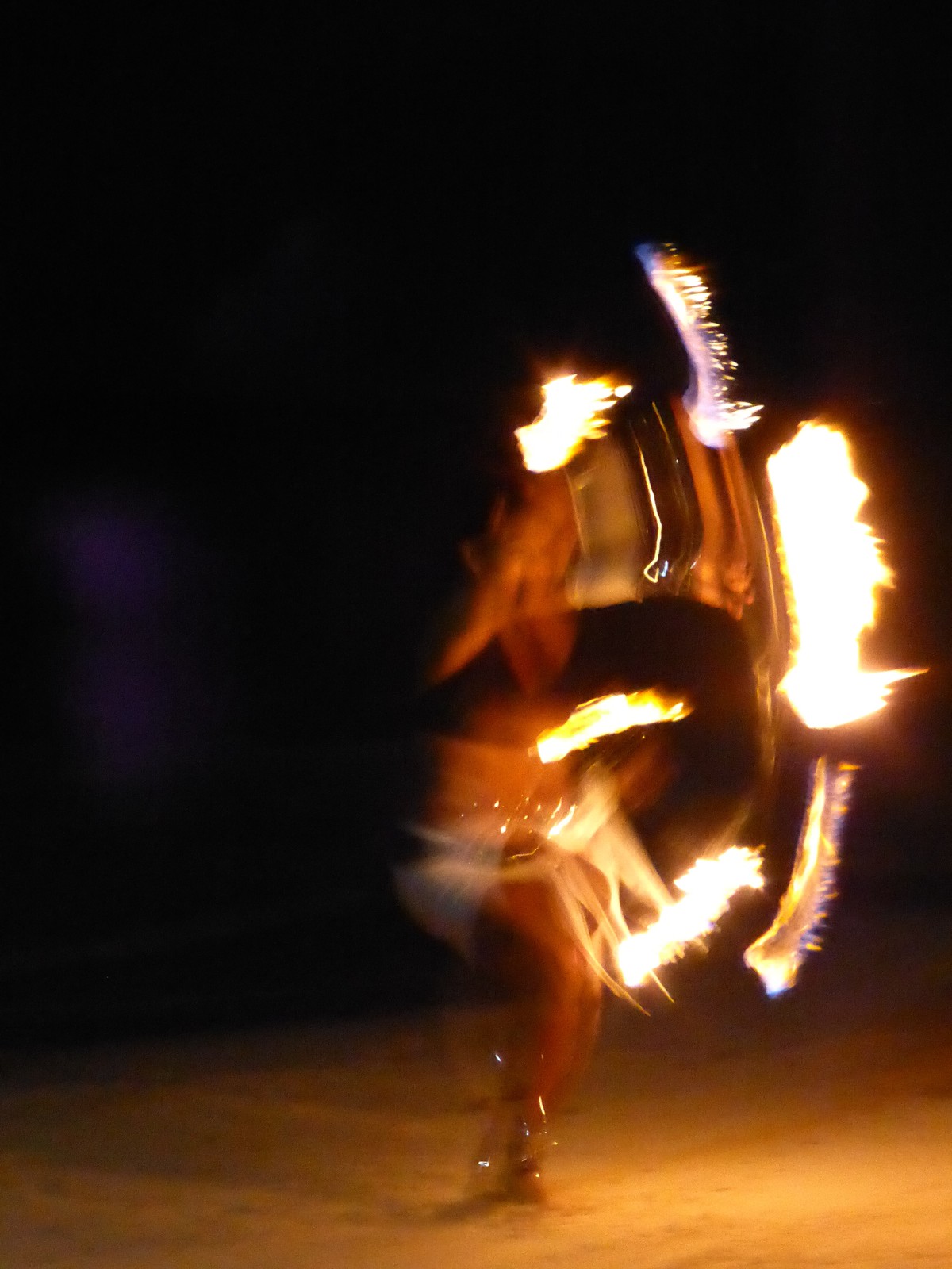 Fire juggling on the beach at Fusion