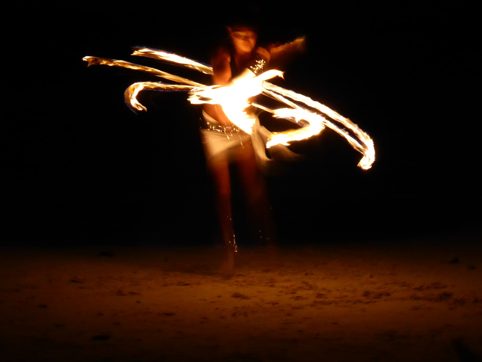 Fire juggling on the beach at Fusion