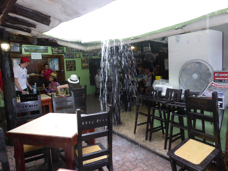 Rain in Tulum pouring through a restaurant roof