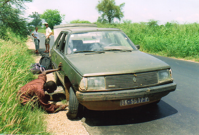 A Senegalese taxi broken down by the side of the road